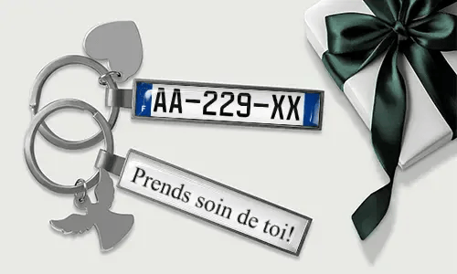 Personalized license plate keychain with heart and wing charms