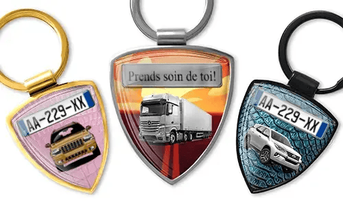 Shield-shaped photo keychain with car and truck designs