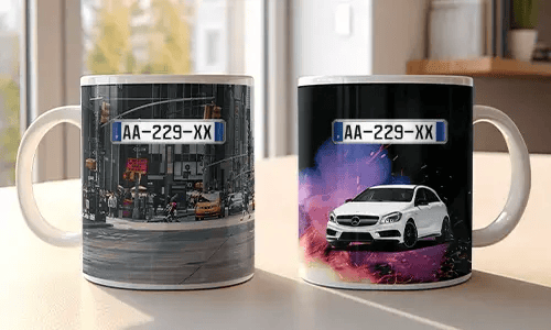 Two white mugs with car-themed prints: red BMW in urban setting, white Mercedes with sparks and colorful background