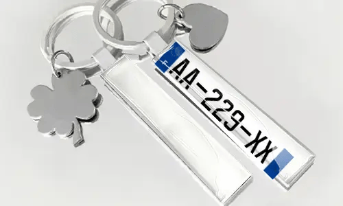 License plate style keychain with flag and charm accessories