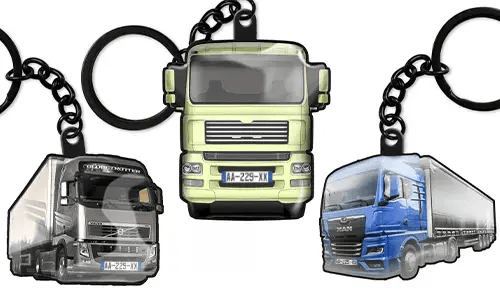 Truck keychains featuring three different lorry designs, including green, grey, and blue models