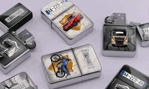 A variety of metal lighters lie on a soft purple surface, featuring personalized designs of cars, motorcycles, and trucks, each marked with different names.