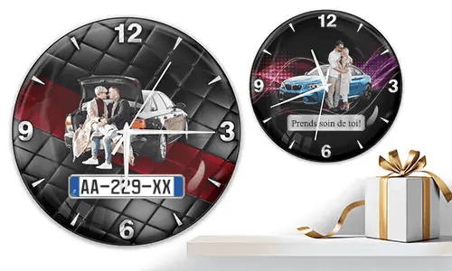 Two wall clocks with family and car scenes: left with trunk picnic on quilted background, right with blue sports car and couple over purple wave